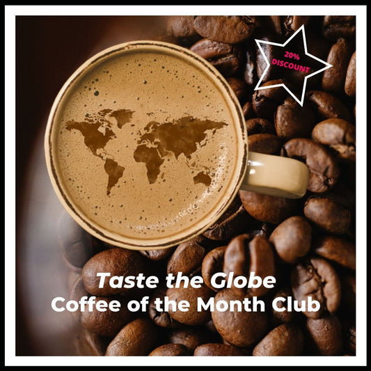 Taste the Globe Coffee of the Month Club. A title page to click into our subscription offering one  pound of coffee from each of our 12 different origin offerings one time a month for 12 consecutive months.  The image is a top down view of a map of the world floating in the crema of the coffee in a coffee mug. The coffee mug is nested in whole bean coffee and a star denotes a twenty percent discount for this offering