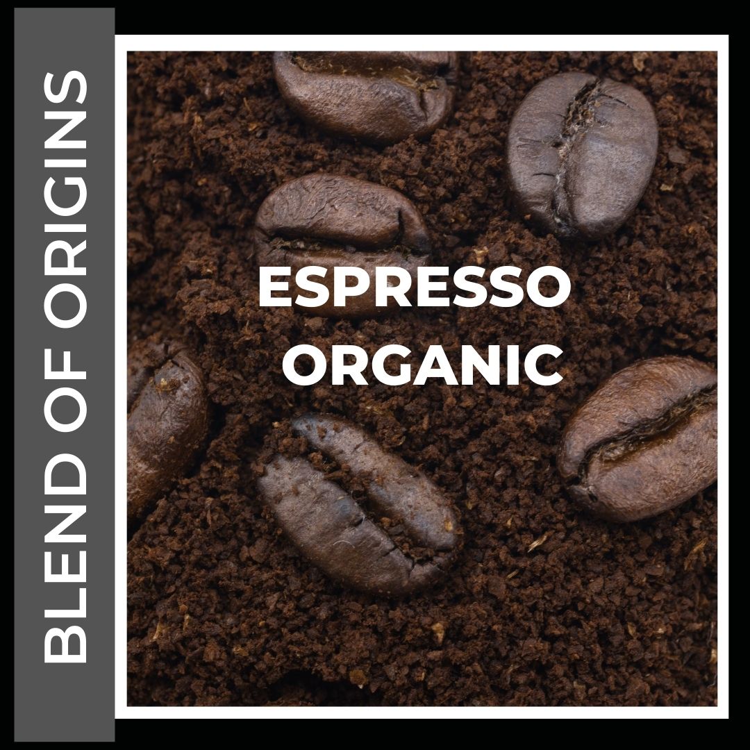 Espresso Organic Coffee. This is a title page Image to click into the various size and consistency options available. This is a picture of coffee beans sitting on ground coffee on a  steel grey colored background to denote this coffee is a special option being our only blend of origins as opposed to a single origin coffee. Specially blended for Espresso style brewing.