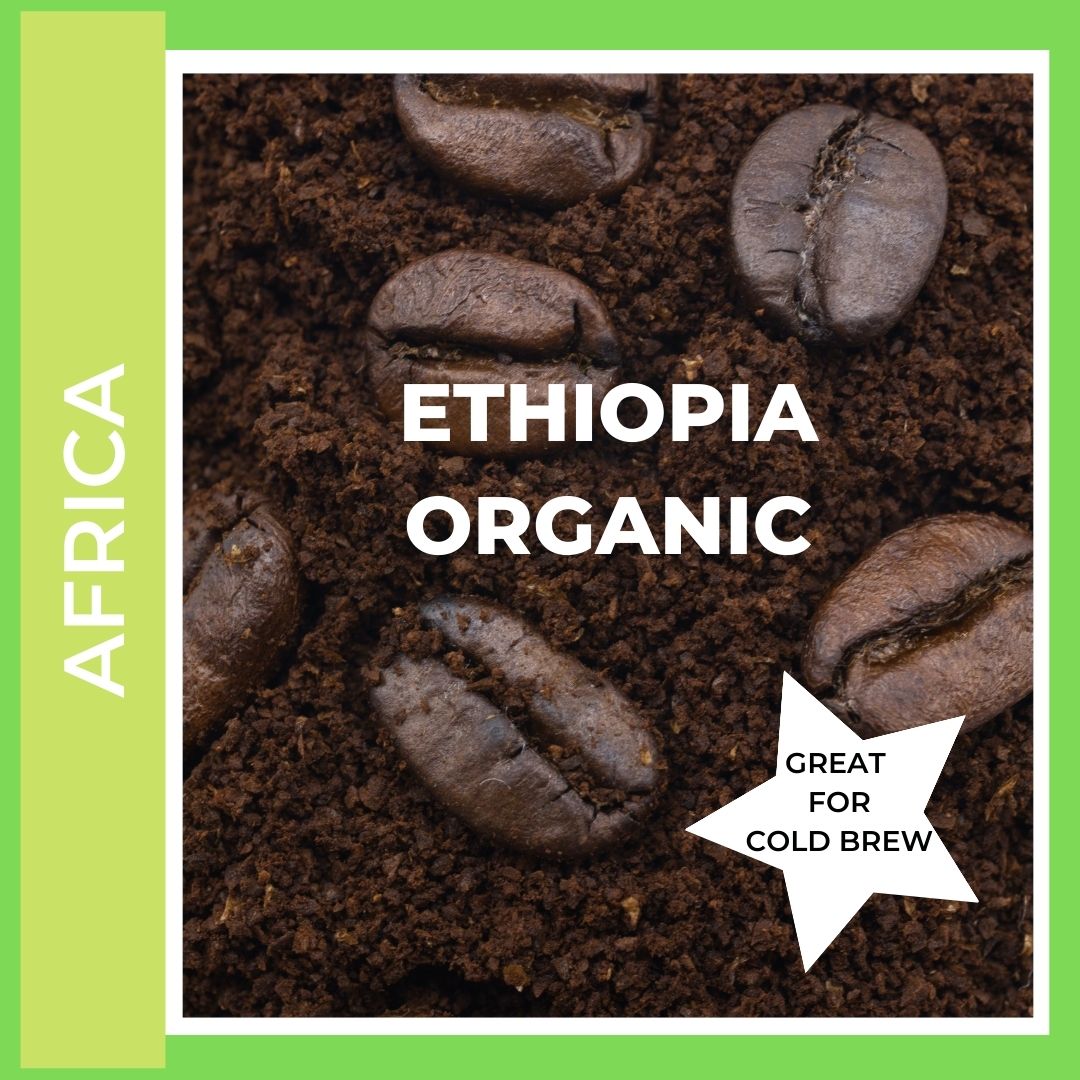 Ethiopia Organic Yirgacheffe  Coffee. This is a title page image to click into the various size and consistency options available. This is a picture of coffee beans sitting on ground coffee on a bright green grass colored background to denote this coffee comes from the Main coffee growing region of Africa. A star states that this is also great for cold brewing.